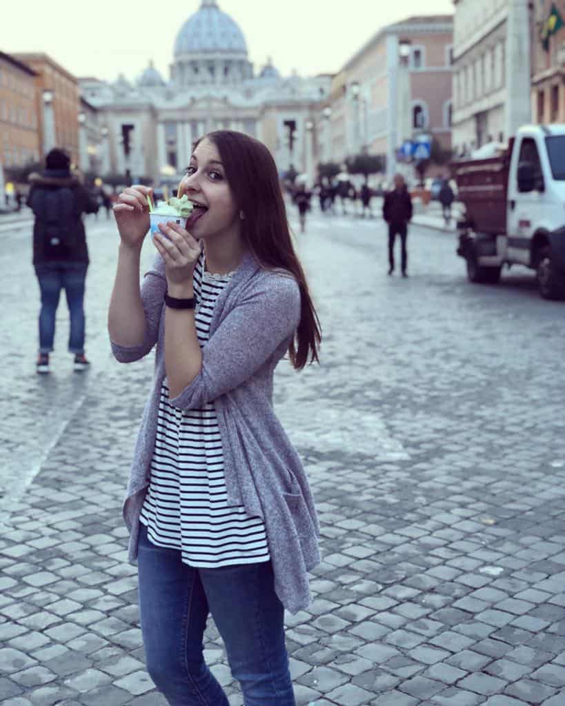 Alexandria eating gelato in front of St. Peter's Basilica