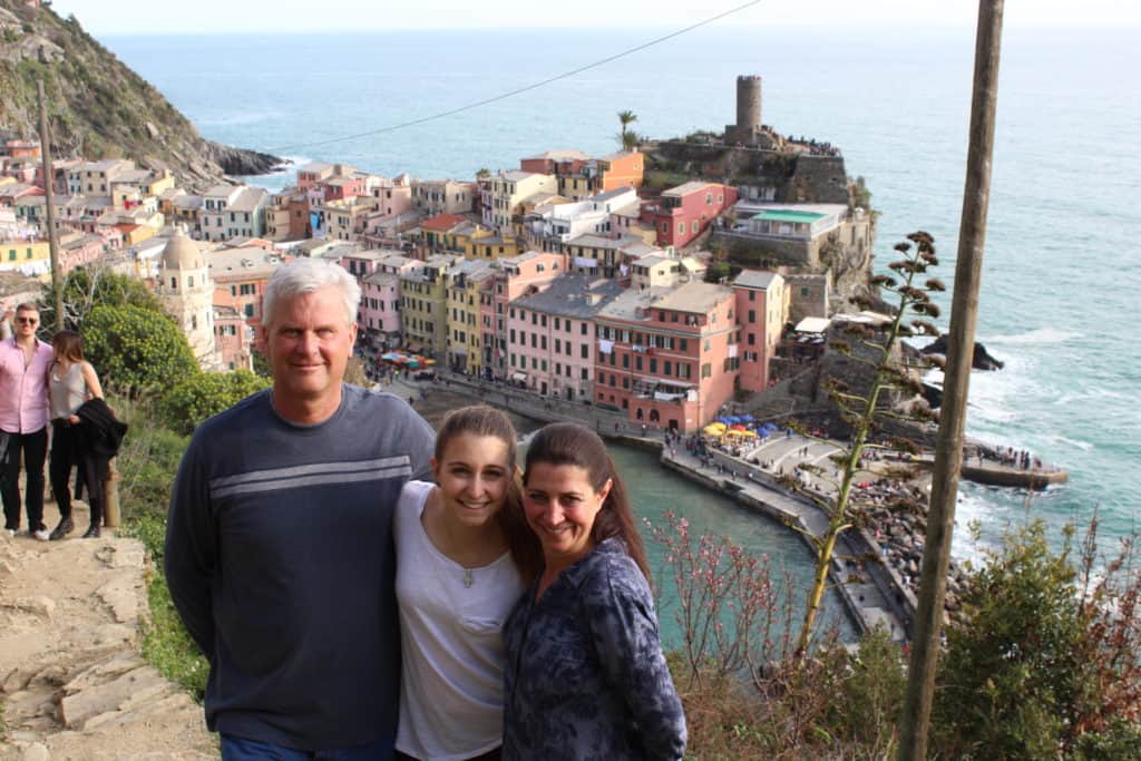 Alexandria with mom and dad in front of the Cinque Terre view