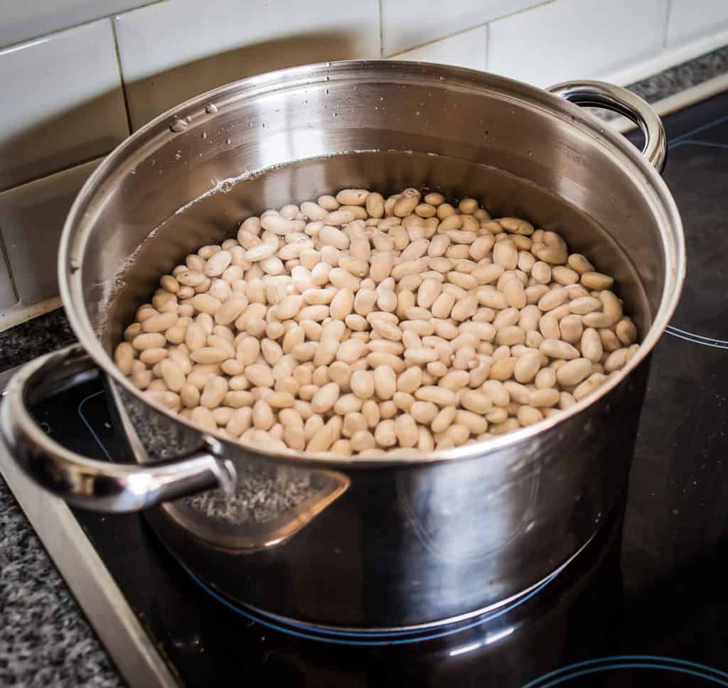 White beans boiling on the stove 