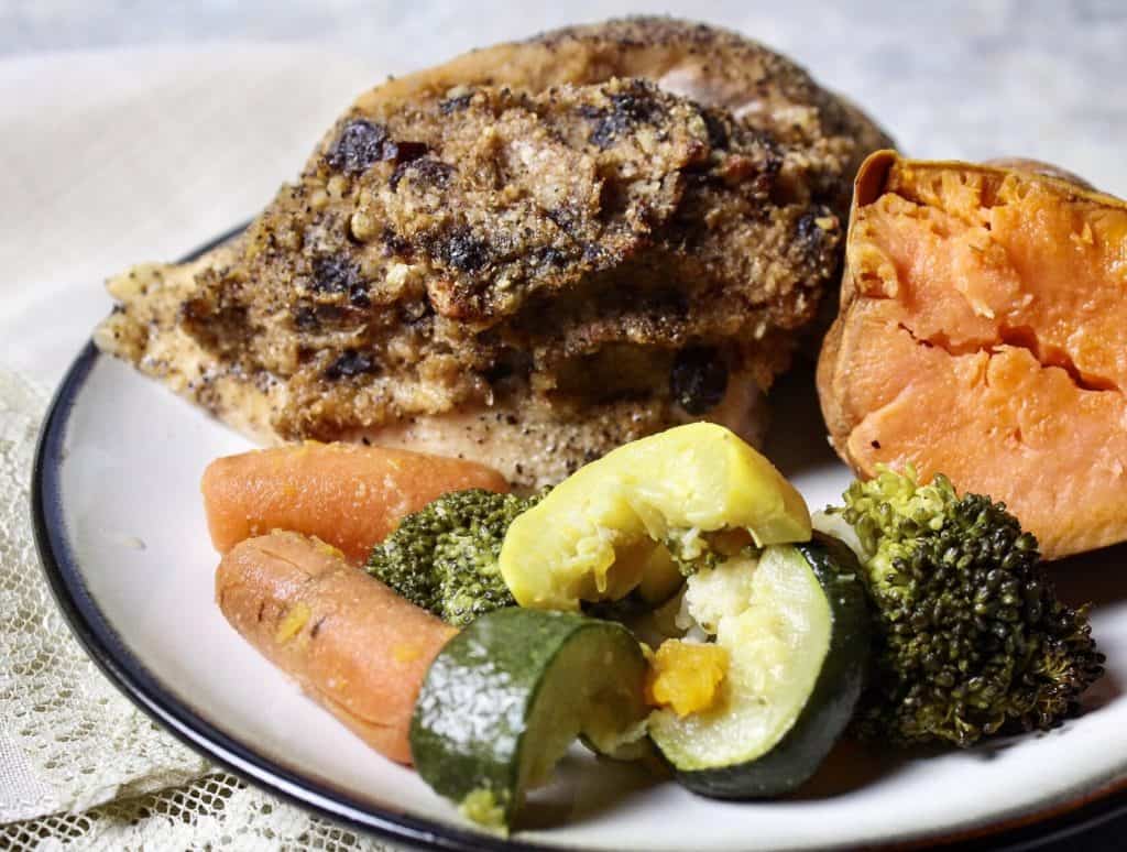 Lavangi on plate with sweet potato and vegetables