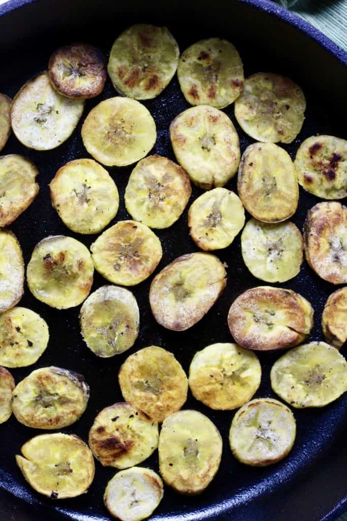 Zoomed out Plantain Chips in a Cast Iron Skillet 