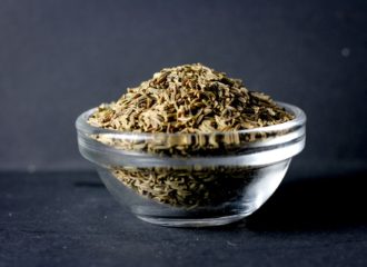 Cumin on black background