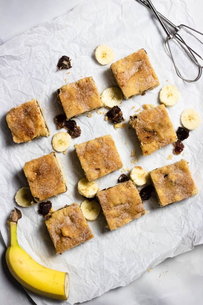 Snickerdoodle Cookie Bars displayed on parchment