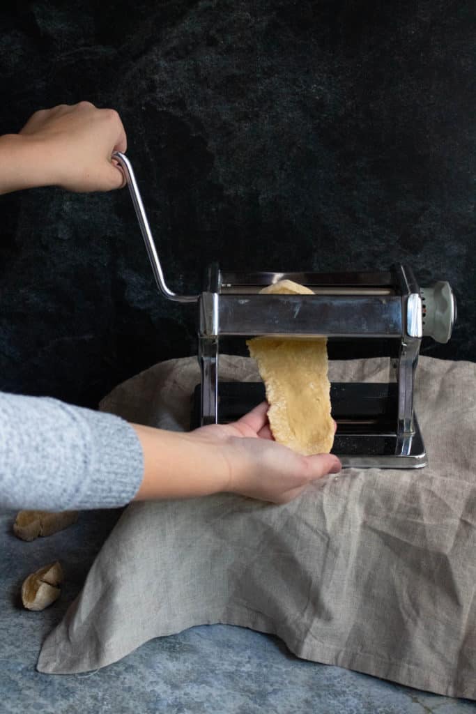 how to make homemade pasta step 6: Roll the pasta through a pasta maker