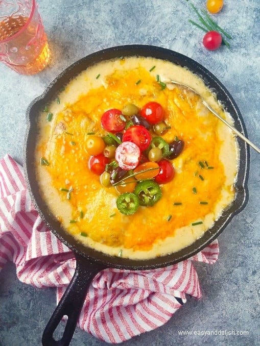 Cod in cheese sauce in a skillet