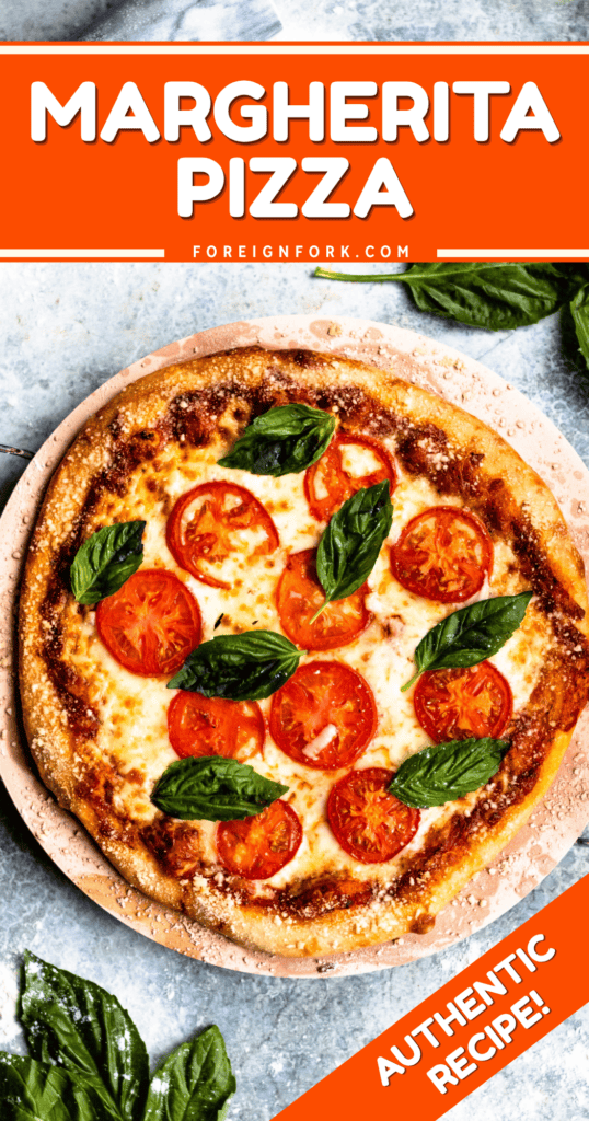 Pinterest image of an overhead view of a full Margherita Pizza with basil leaves and tomatoes.