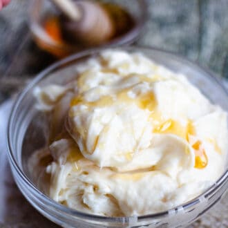 Bowl of honey cream cheese frosting