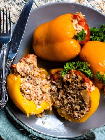 Instant Pot stuffed peppers on a gray plate.