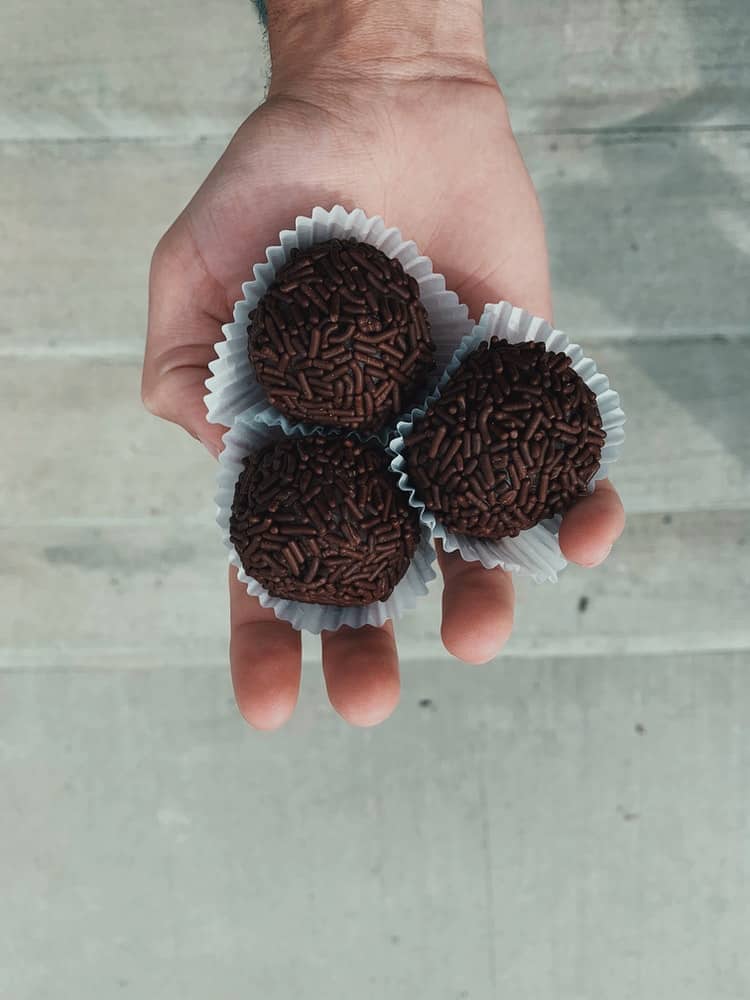 Hand holding brigadeiros