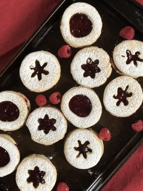 Shortbread cookies with Jam on a red background 