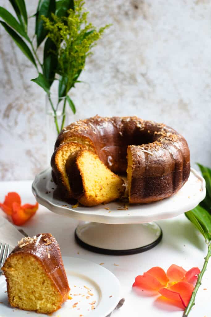 Rum Cake Recipe from the Bahamas with orange and green flowers