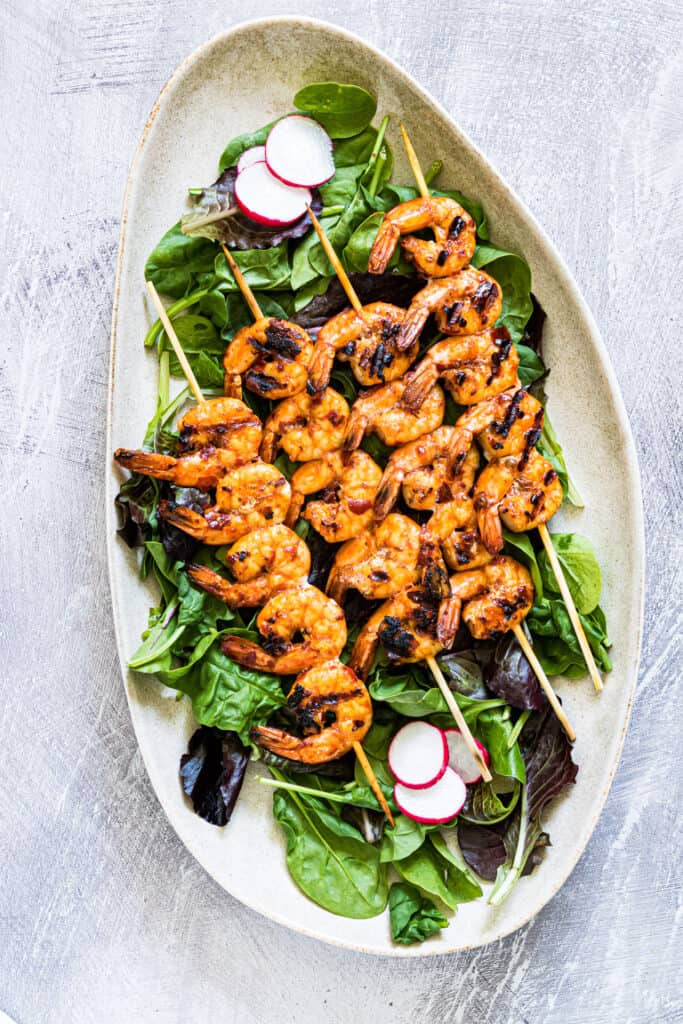 Perfect fourth of july recipe: Korean shrimp skewers on a bed of lettuce 