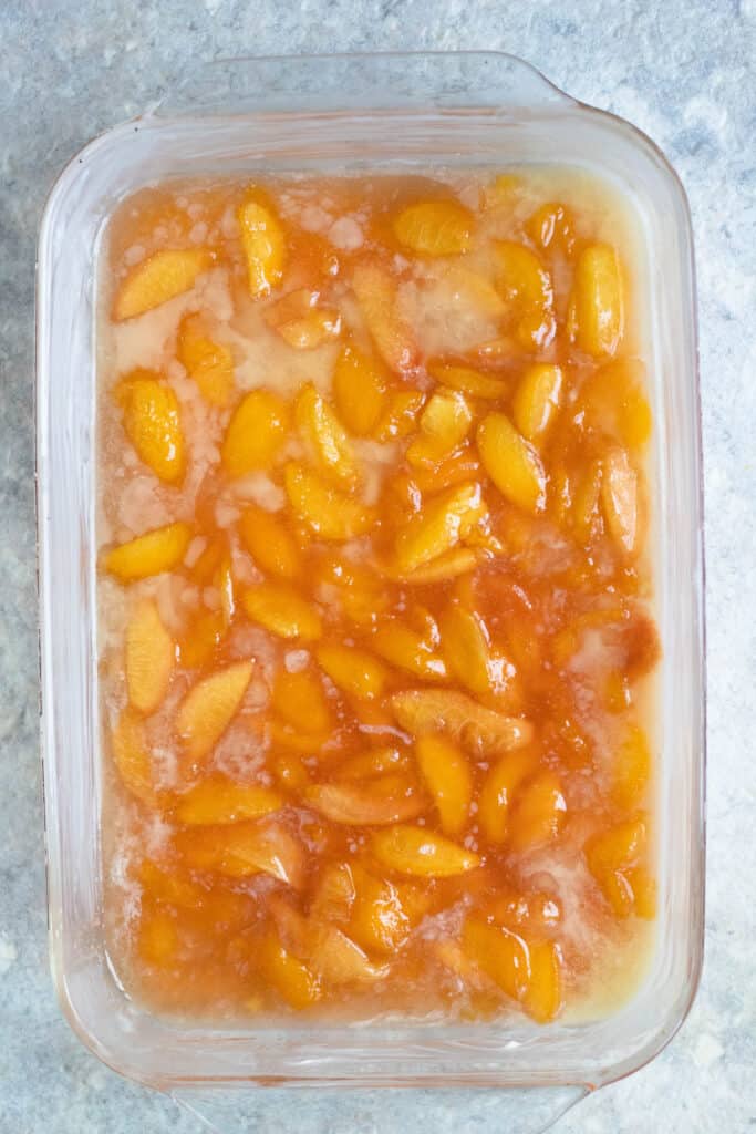 a 9x13 pan filled with peaches 