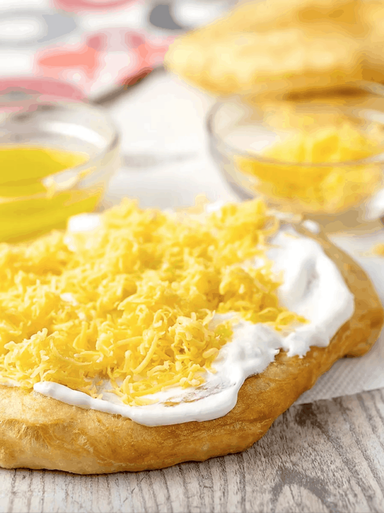 Hungarian food: Langos, a deep fried bread with sour cream and cheese