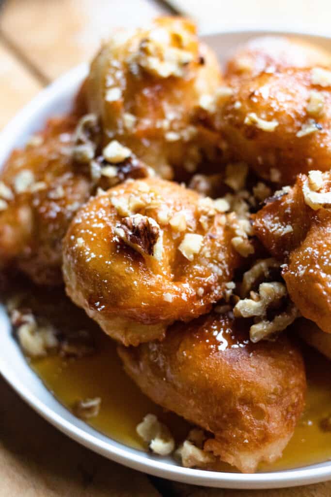 Cypriot Food: Loukoumades covered in walnuts and honey 