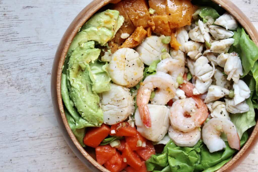 Overhead view of Caribbean Seafood Salad in a wooden bowl 