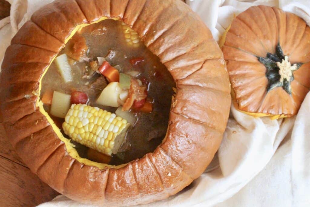 Overhead view of beef stew in a pumpkin shell 