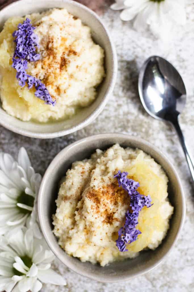 Close up of couscous pudding with daisies in the background