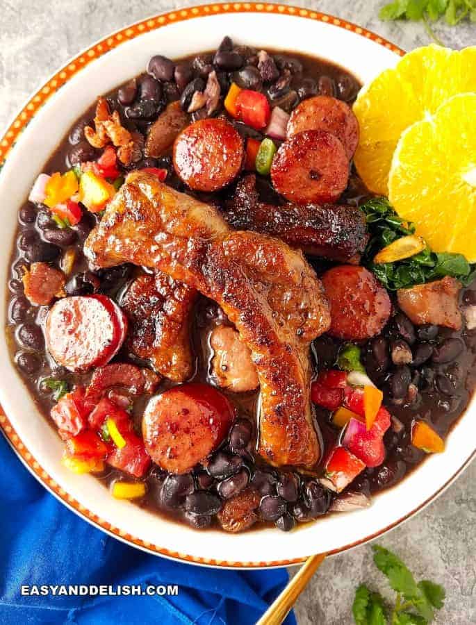 A Brazilian stew with meat, beans, sausage, and citrus 