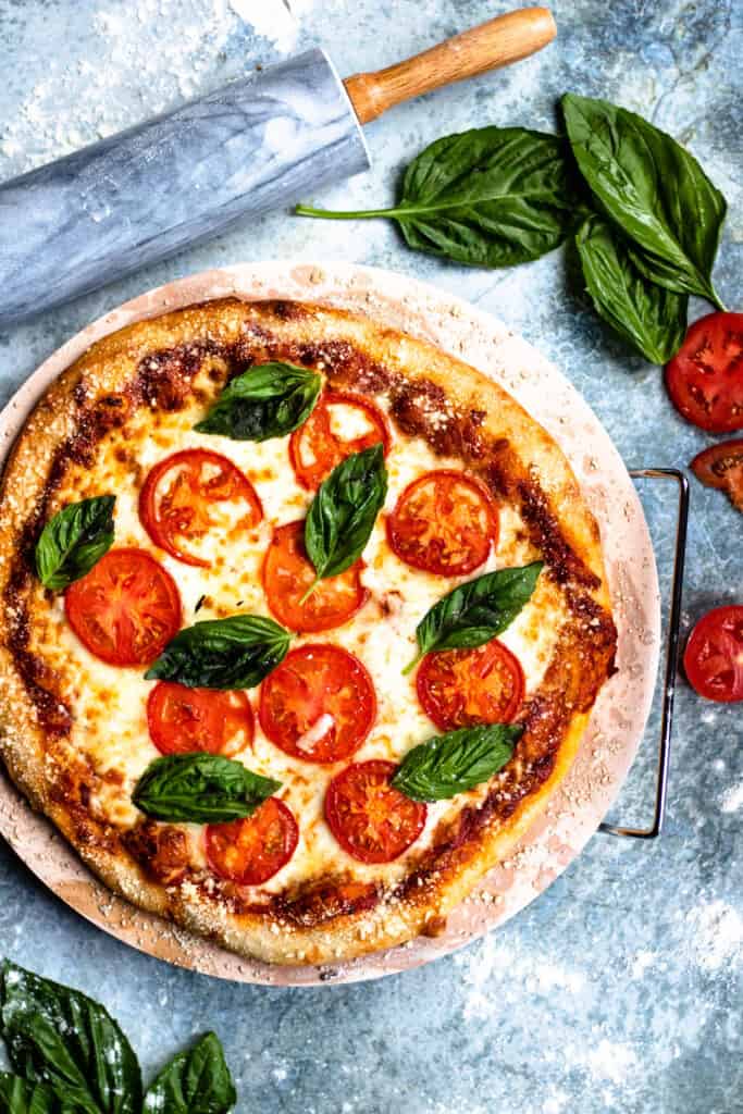 Margherita pizza with basil leaves on top 