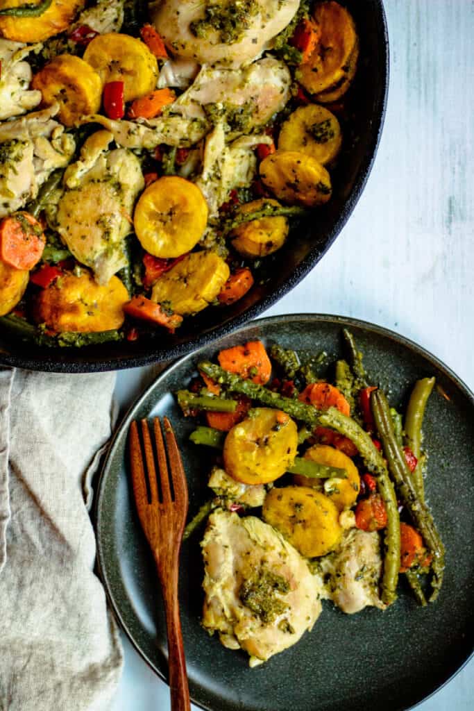 Overhead view of Cast Iron Skillet chicken thighs with vegetables and plantains 