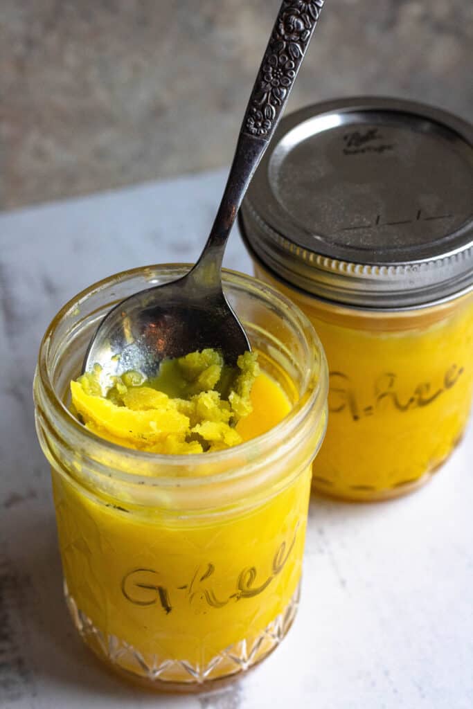 Cooled, hardened ghee in a spoon 