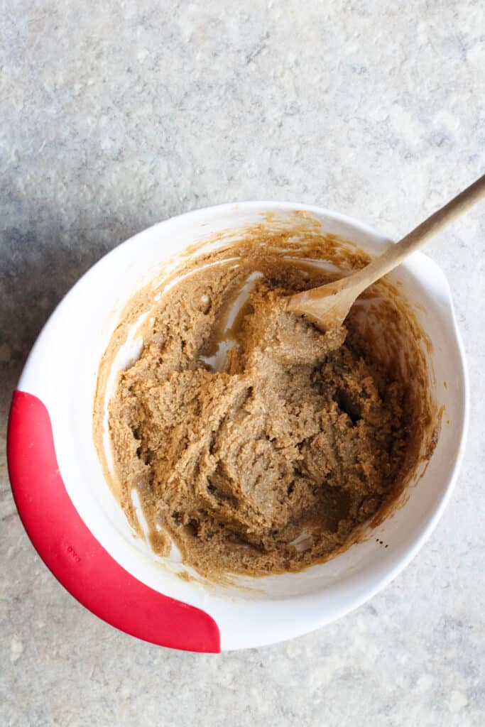 Cookie dough with a wooden mixing spoon 