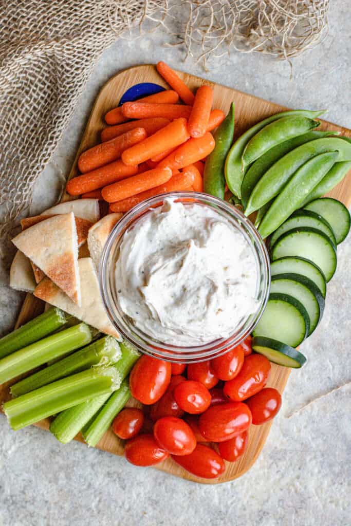 Full platter of healthy veggie dip with dippers on the side