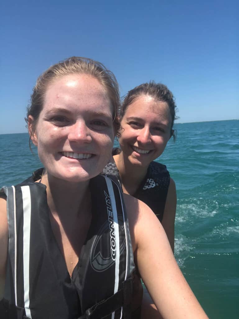 Alexandria and elizabeth taking a selfie on the jet ski.