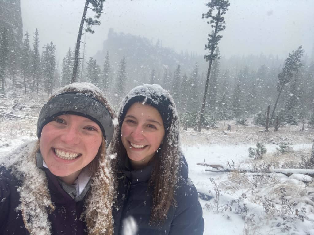 Alexandria and Lindsey taking a selfie in the South Dakota mountains in a blizzard.