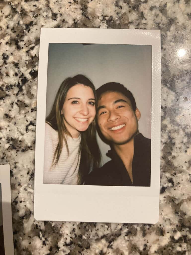 Photo of a polaroid picture of two friends taking a selfie.
