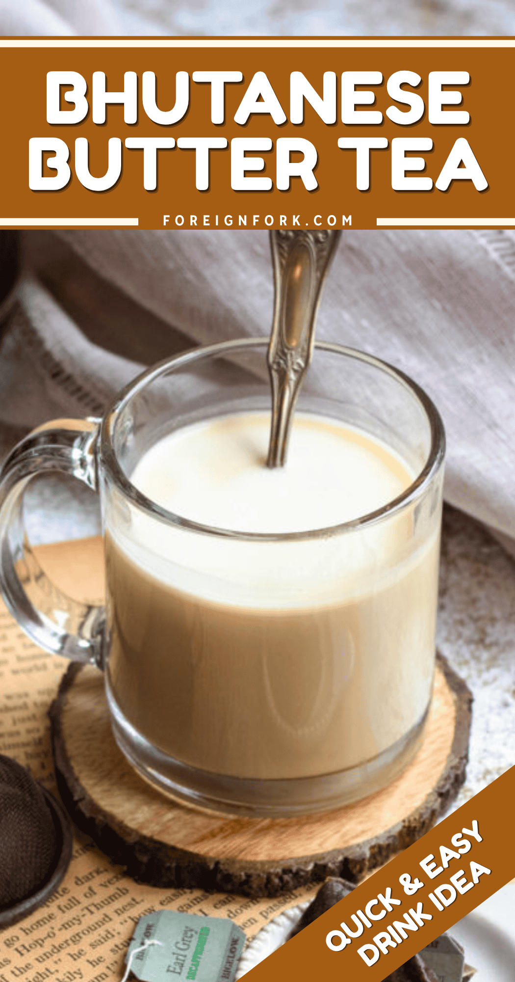 Pinterest image of a cup of Bhutanese Butter Tea with a teaspoon on top of a coaster.