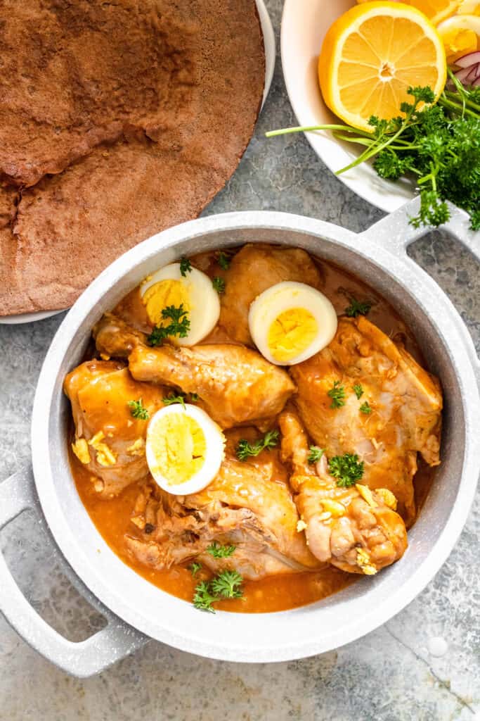 Close up of Doro Wat with hard boiled eggs and parsley 