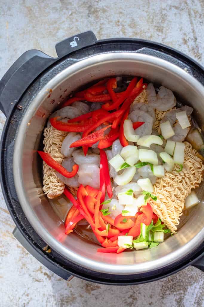 Instant pot with noodles and vegetables in it 