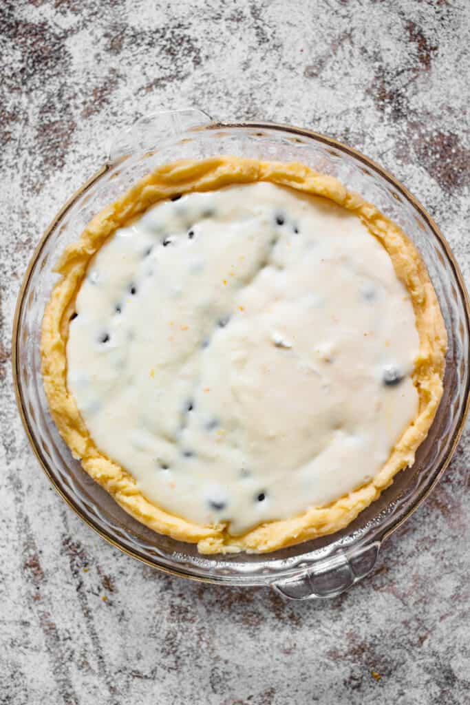Pie crust with filling and blueberries