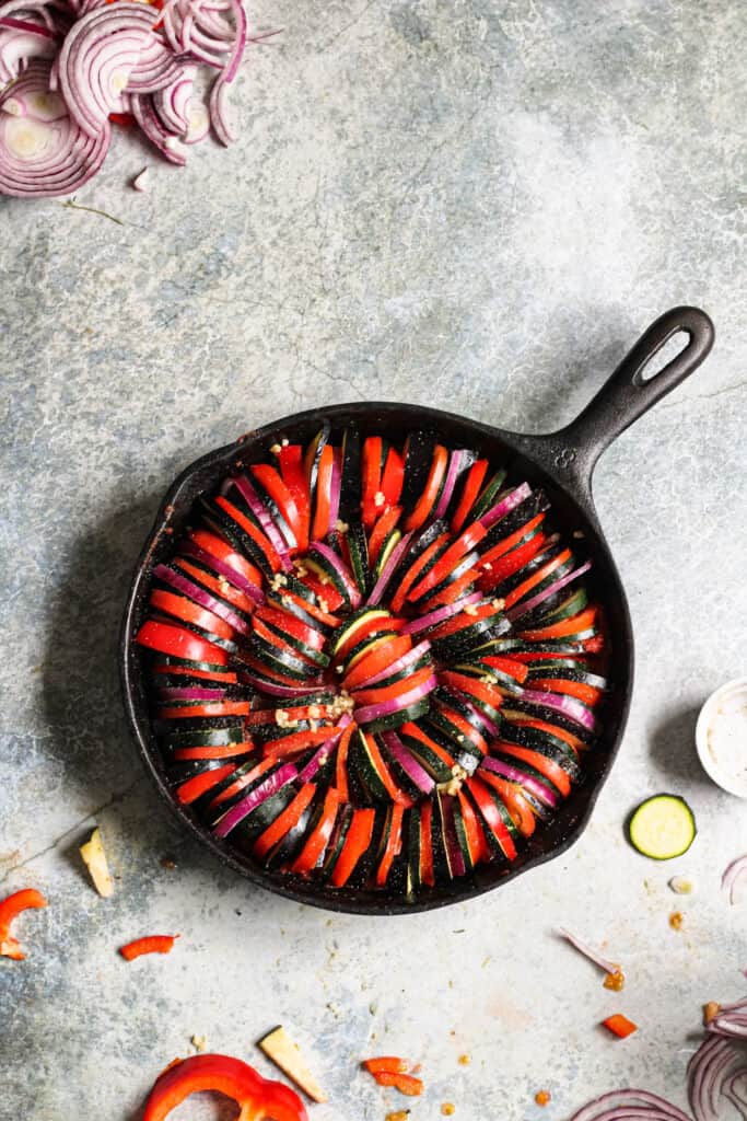 raw vegetables in a cast iron skillet 