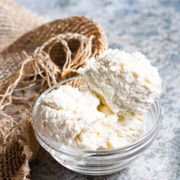 A bowl with small scoops of ricotta cheese.
