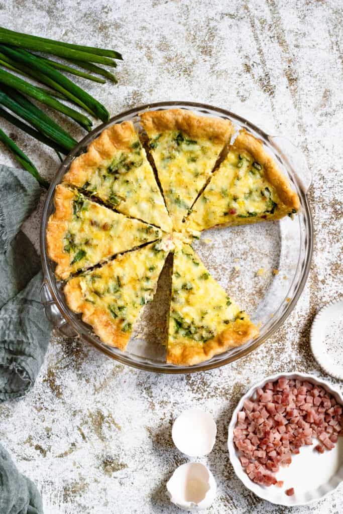 Pie pan with 6 slices of french quiche