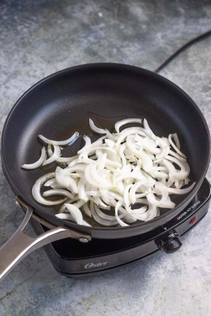 raw onions in a pan