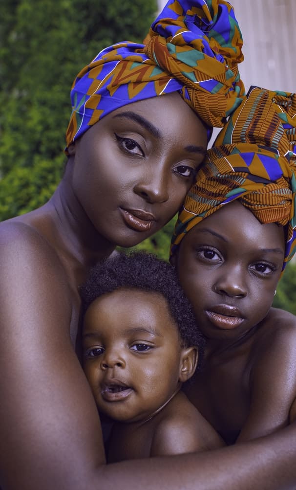 Ghanaian family, with the girls in head wraps