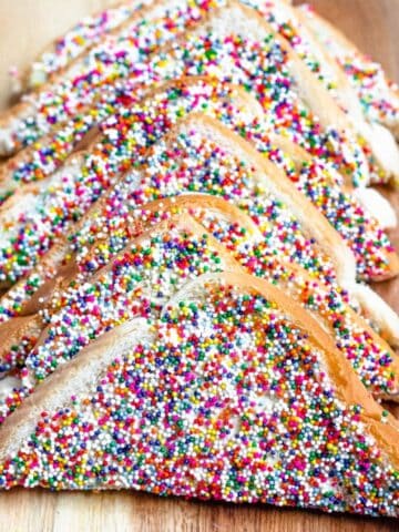 Sprinkle coated fairy bread laying against one another.
