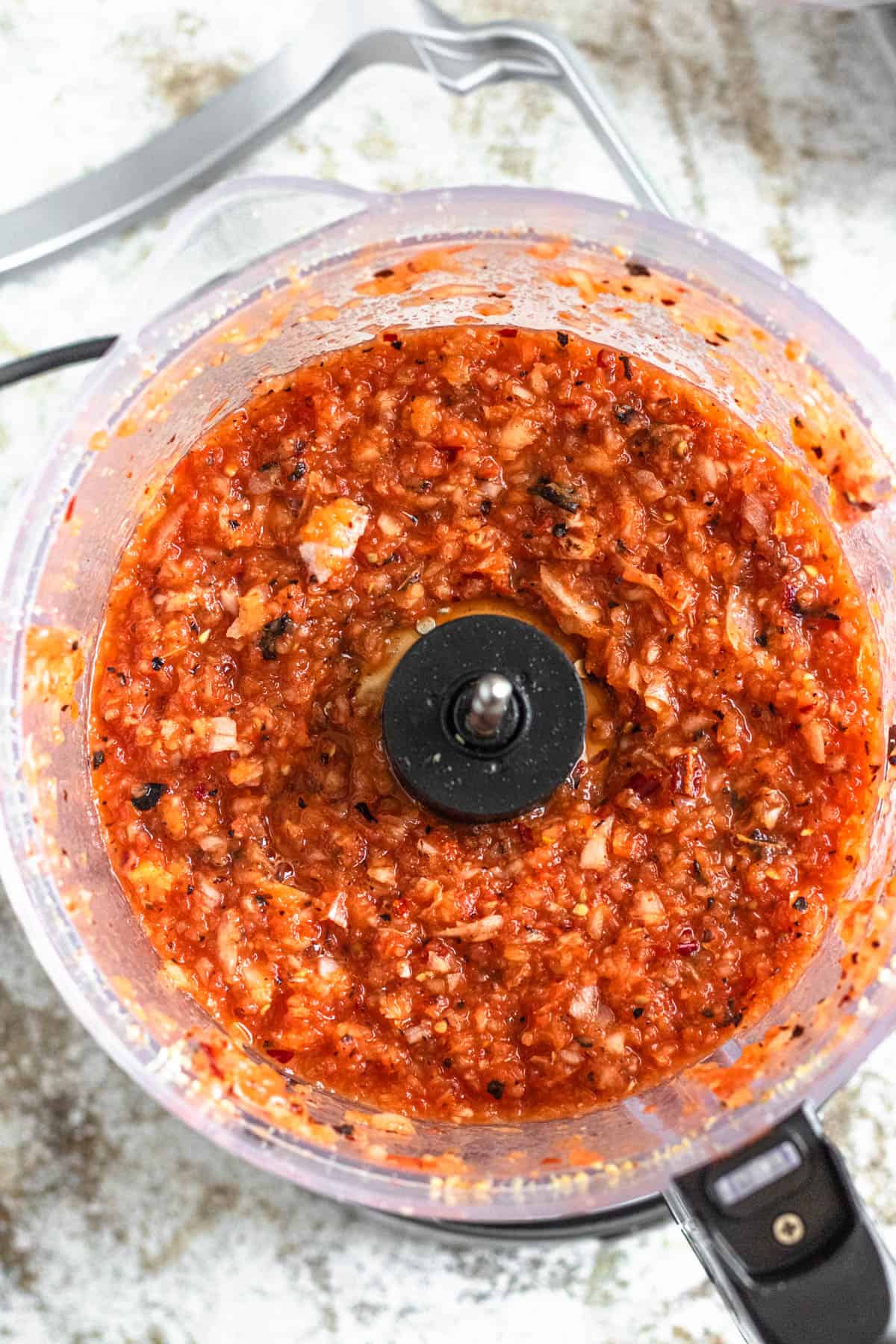 Blended tomatoes and onions in a food processor
