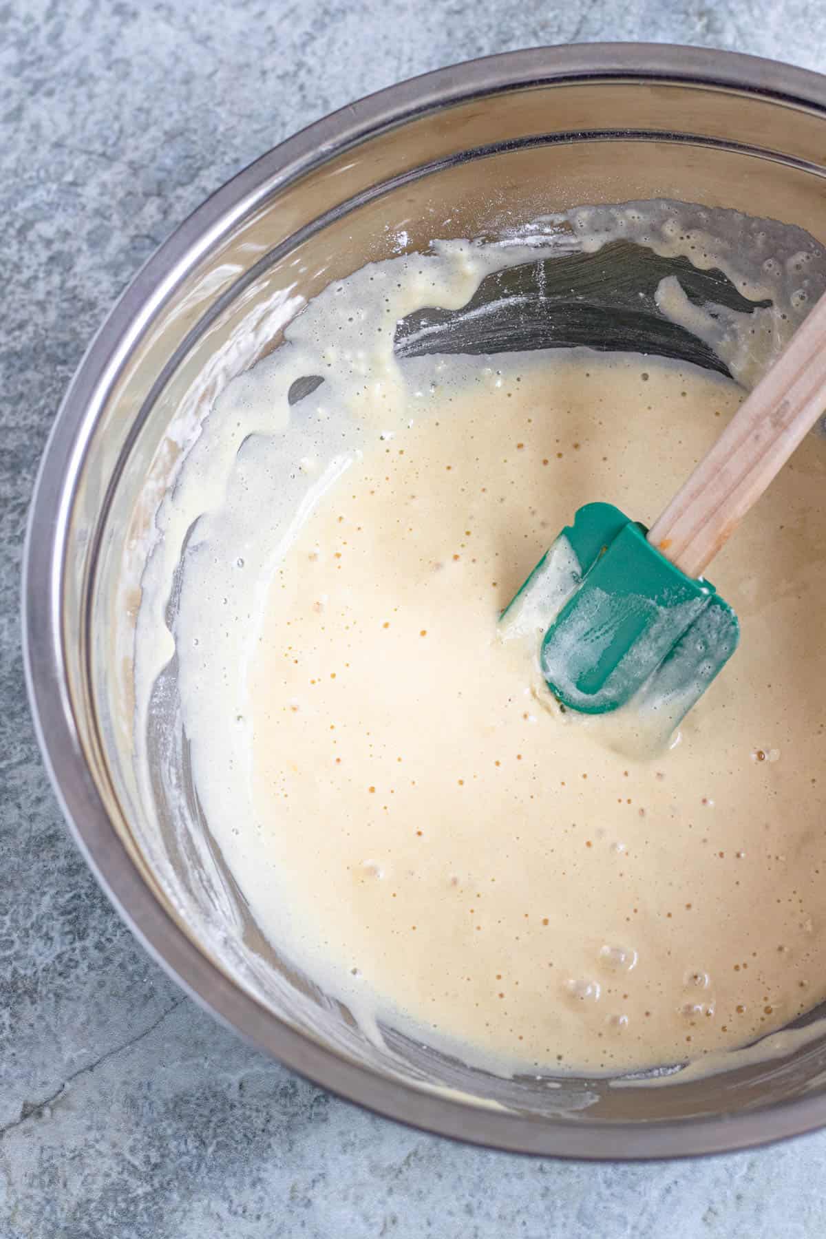 Batter in a mixing bowl with a rubber spatula 
