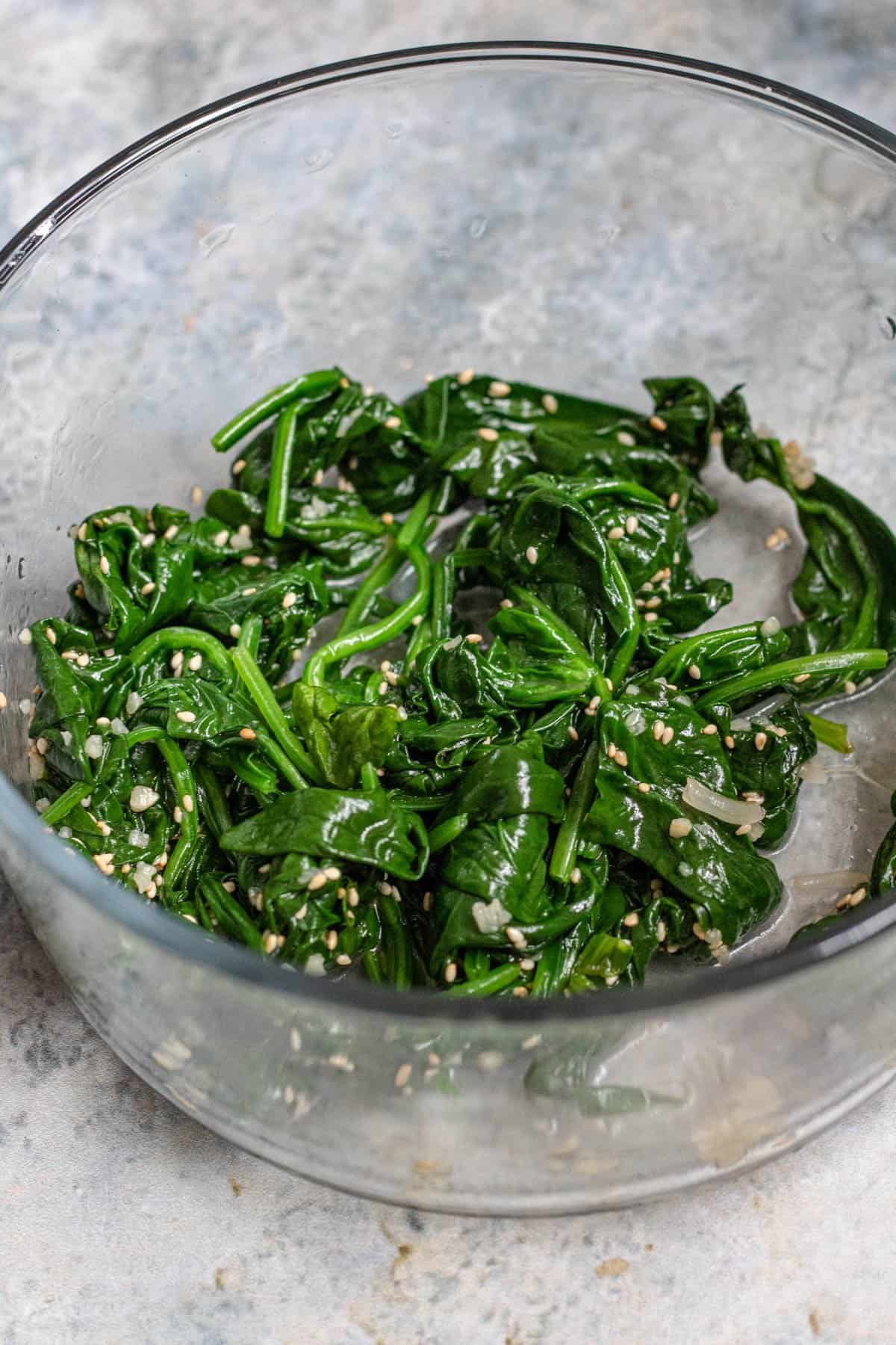 Bowl of spinach with sesame seeds