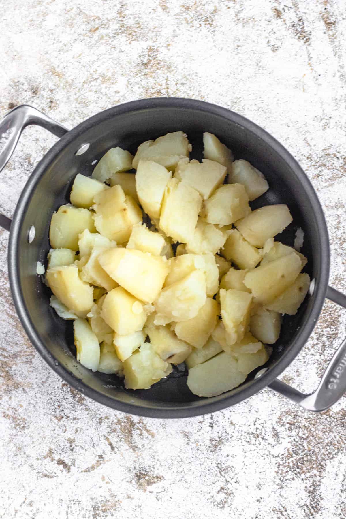 pot of cooked, cubed potatoes