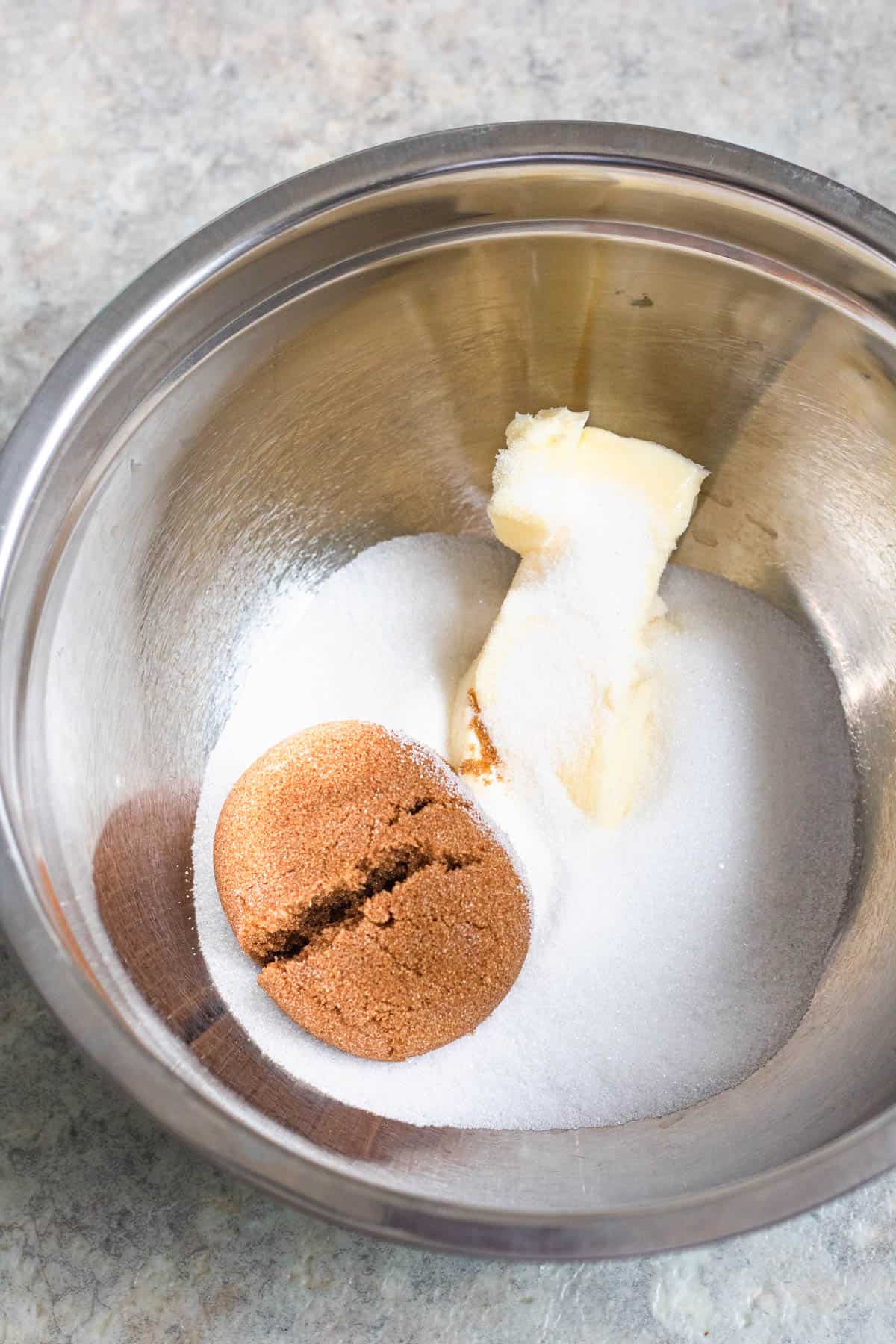 butter and sugars in a mixing bowl 