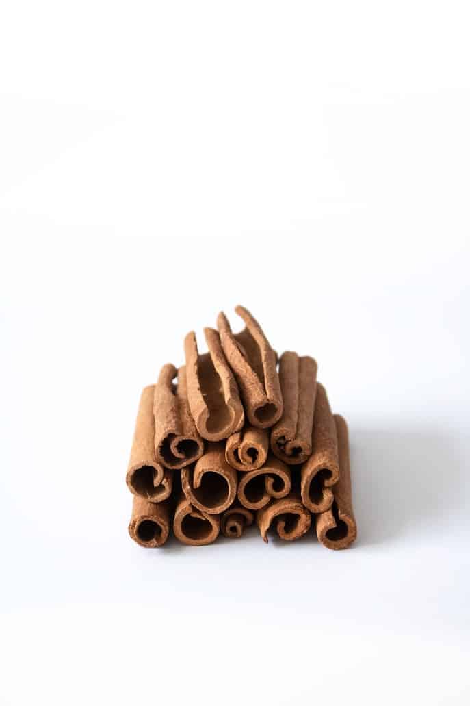 Cinnamon bark arranged in a pile.