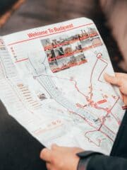 A person holding a Budapest map.