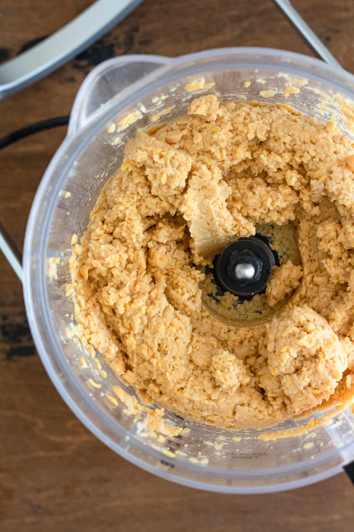 Food processor with chickpeas blended. 