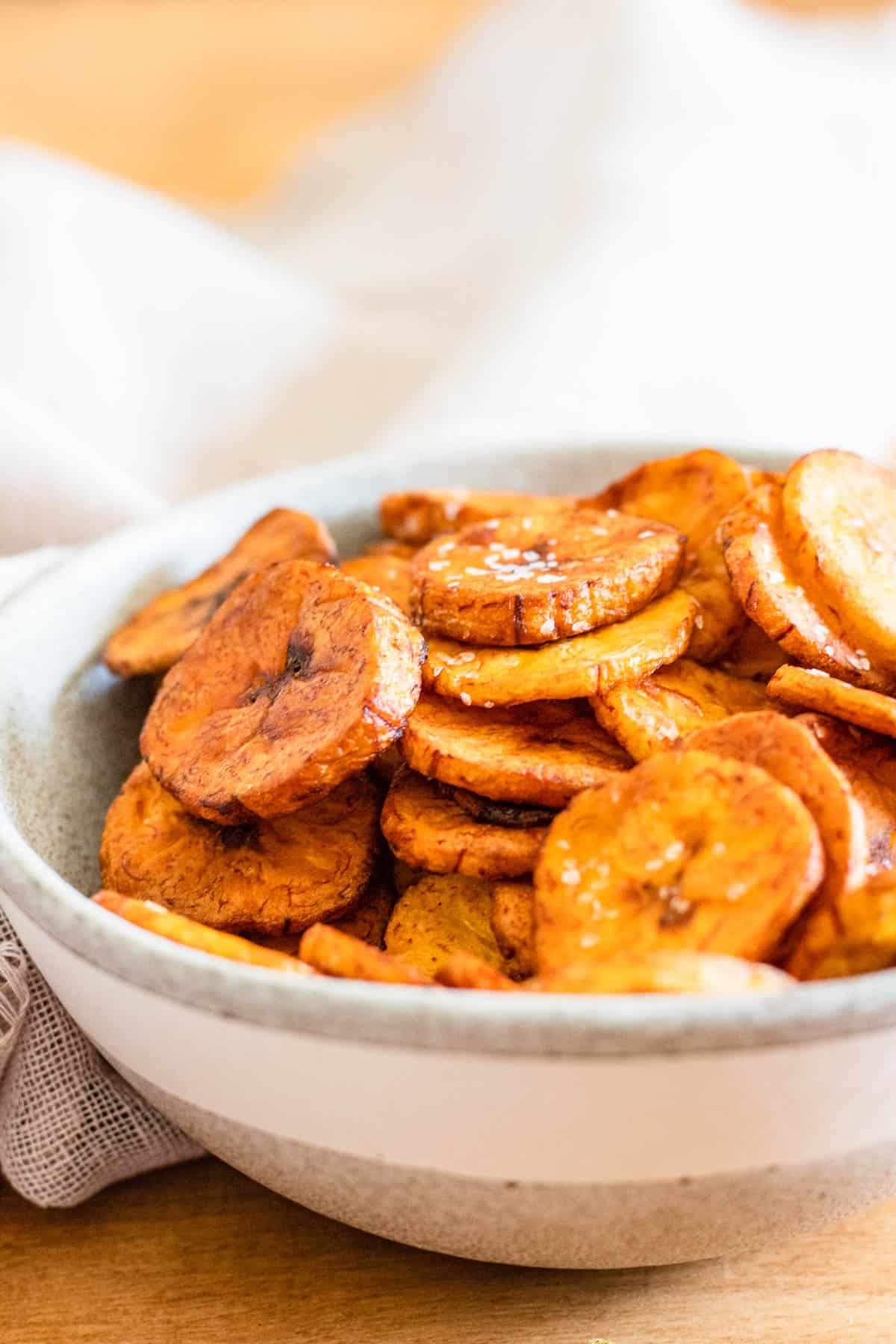 Sweet plantain chips with sea salt on top in a bowl. 